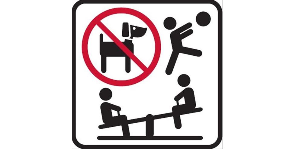 Hundeverbot auf Spielplätzen lt Verordnung Piktogramm zu einem Hundeverbotsschild. Ein durchgestrichener Hund und Kinder auf einem Spielplatz.